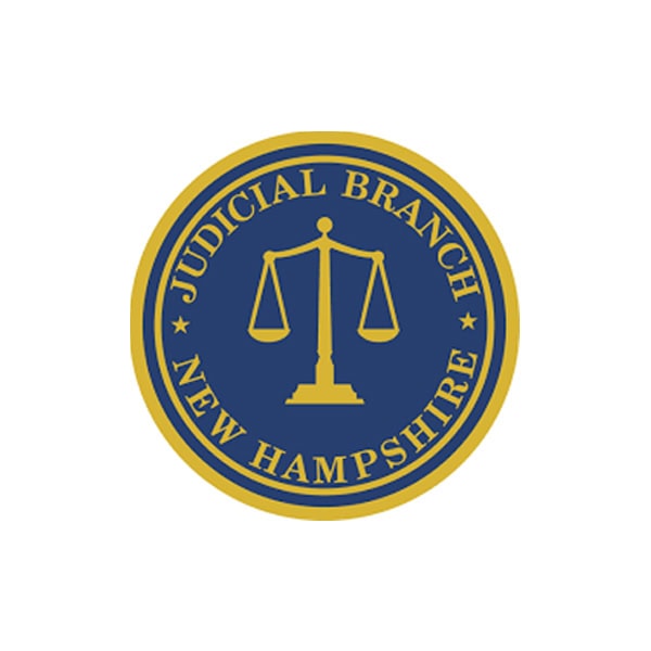 Seal of the New Hampshire Judicial Branch featuring a gold balance scale on a blue background with gold text and border.