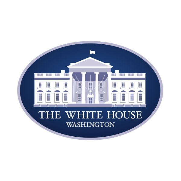 The White House logo featuring a white illustration of the White House building on a blue oval background, with the words "THE WHITE HOUSE WASHINGTON" below.